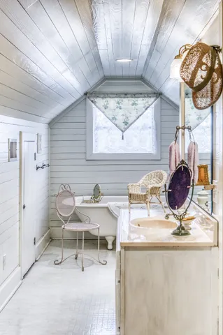 a living room with a table and chairs