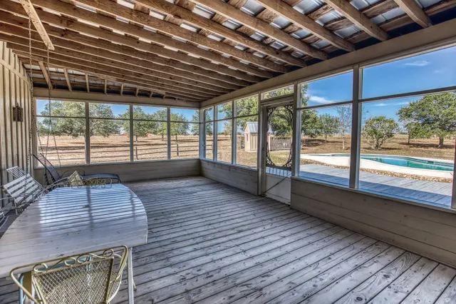 a view of a deck with wooden floor and outdoor space