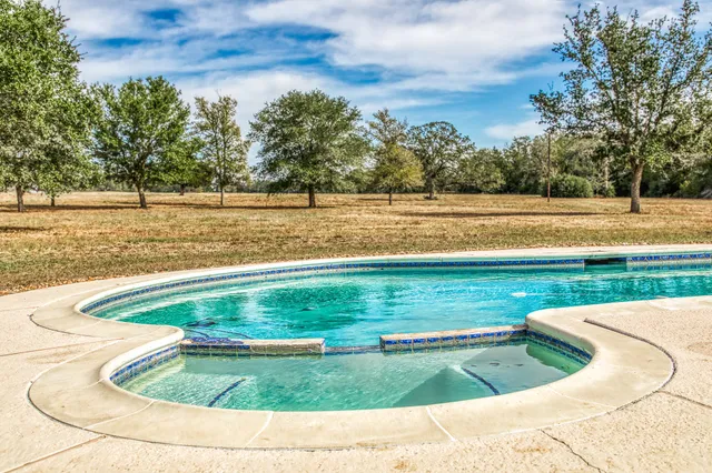a view of a lake with a yard