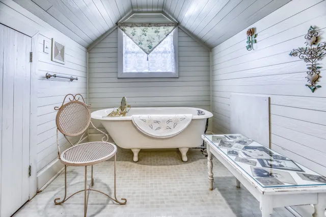 a bathroom with a sink a mirror and a toilet