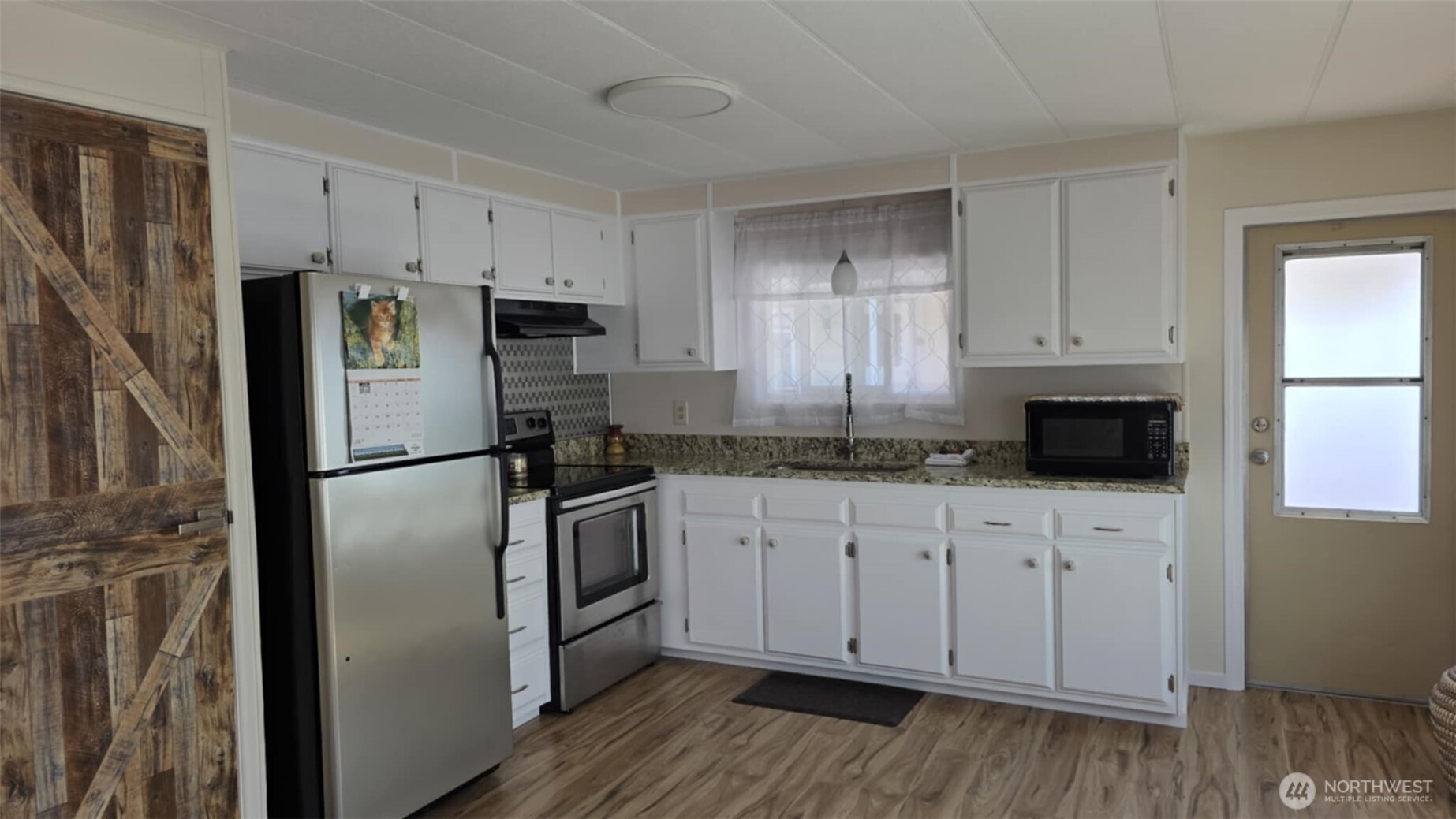 207 Ho Hum Lane Aberdeen, WA 98520 - Photo 11 of 22 a kitchen with stainless steel appliances a refrigerator stove and sink