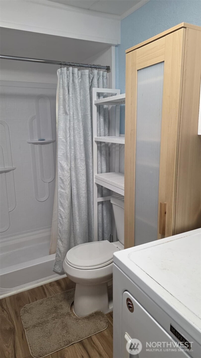 207 Ho Hum Lane Aberdeen, WA 98520 - Photo 17 of 22 a bathroom with a sink a toilet and shower