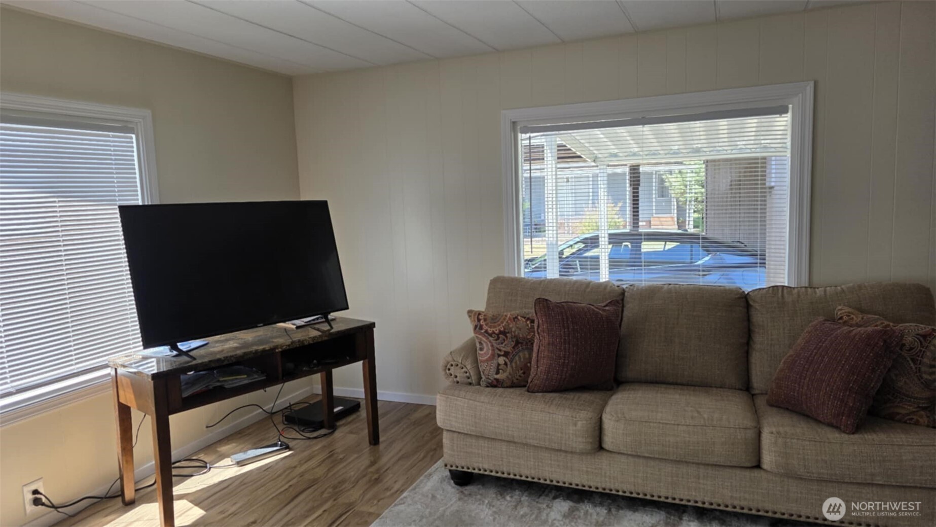 207 Ho Hum Lane Aberdeen, WA 98520 - Photo 8 of 22 a living room with furniture and a flat screen tv
