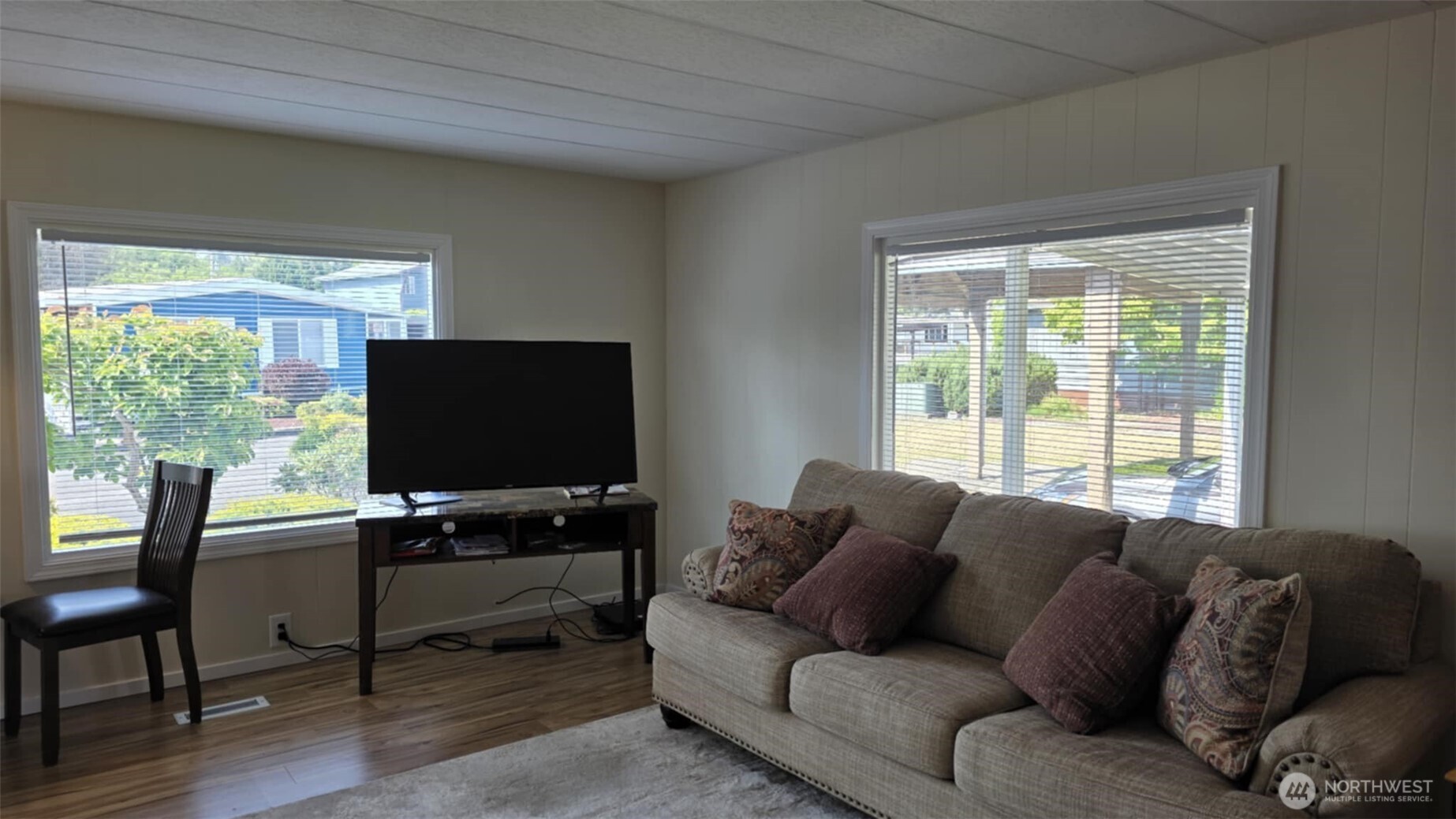 207 Ho Hum Lane Aberdeen, WA 98520 - Photo 9 of 22 a living room with furniture and a flat screen tv