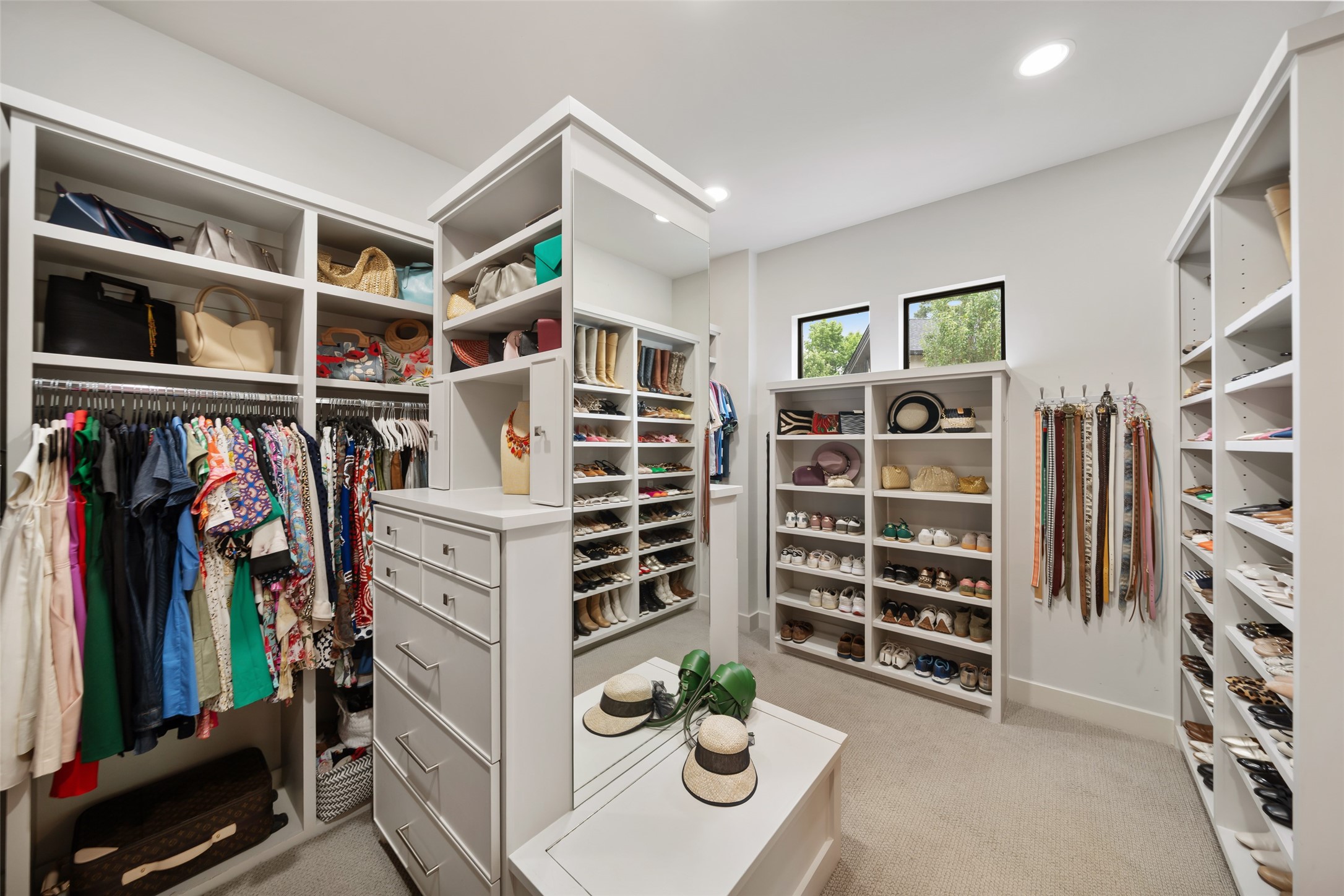 24902 Delaney Knoll Spring, TX 77389 - Photo 18 of 49 a view of walk in closet with clothes and shoes