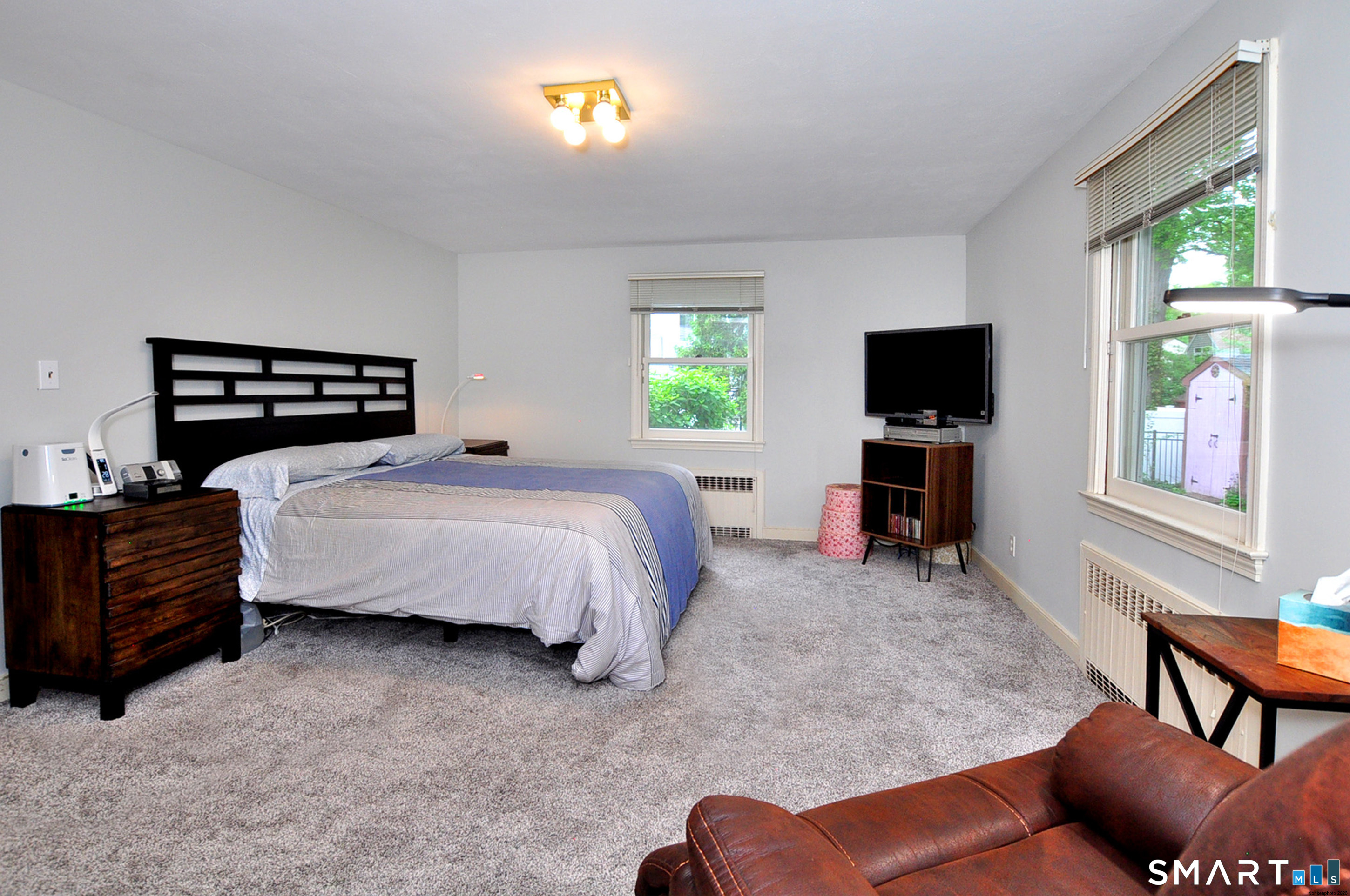 44 Miamis Road West Hartford, CT 06117 - Photo 23 of 39 a bedroom with a bed and a television
