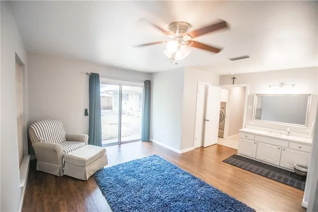 a living room with furniture and a rug