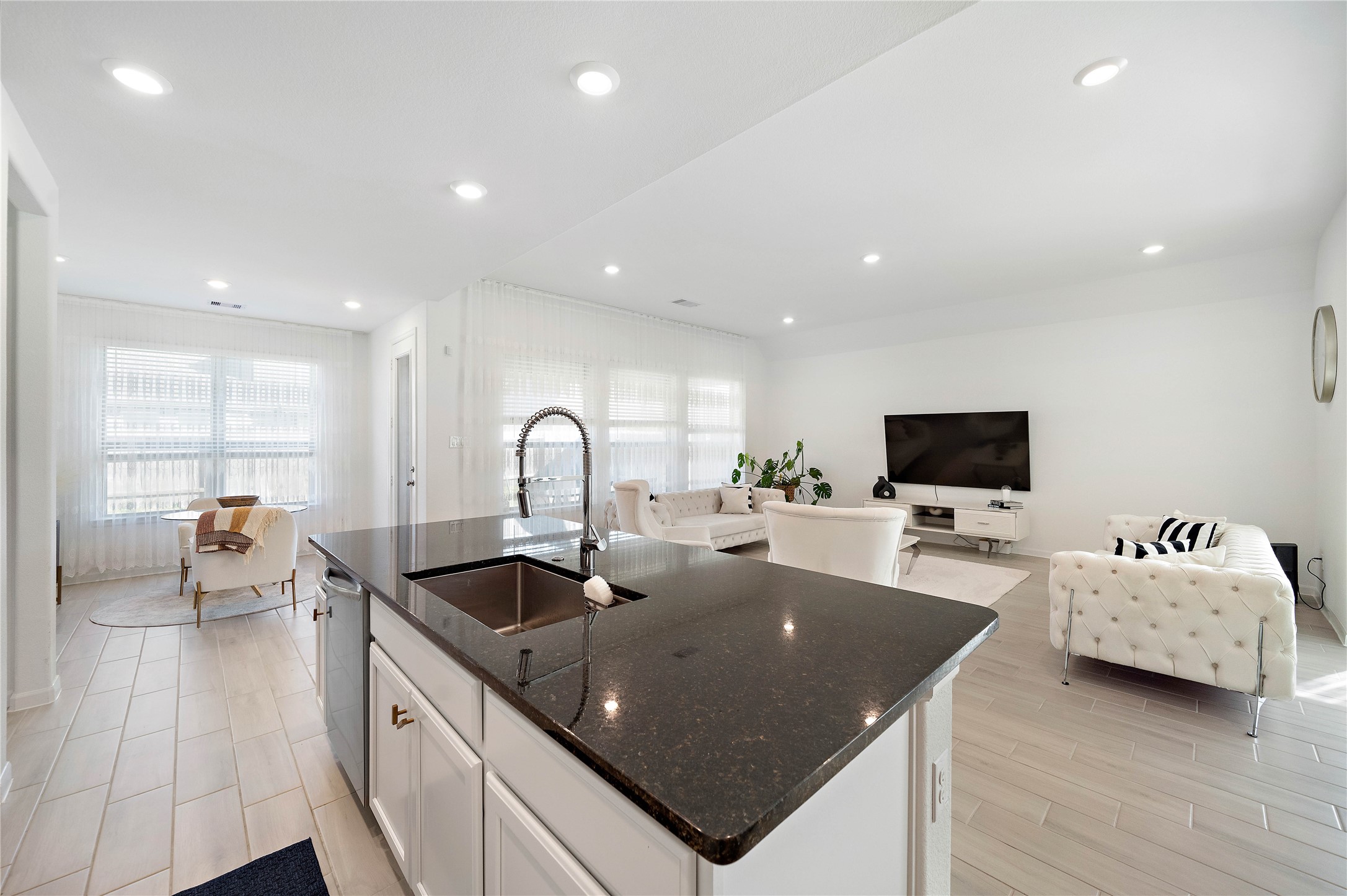 2239 Ginger Trail Lane Rosenberg, TX 77469 - Photo 21 of 35 a kitchen with sink refrigerator and couch
