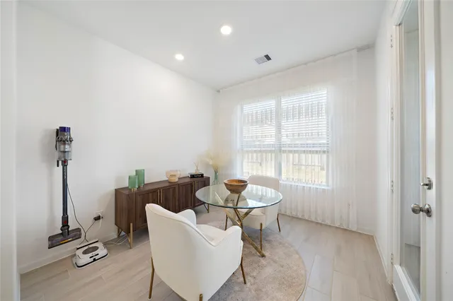 a view of a dining room with furniture window and outside view