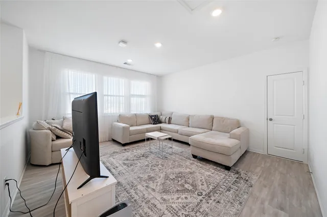 a living room with furniture and a couch