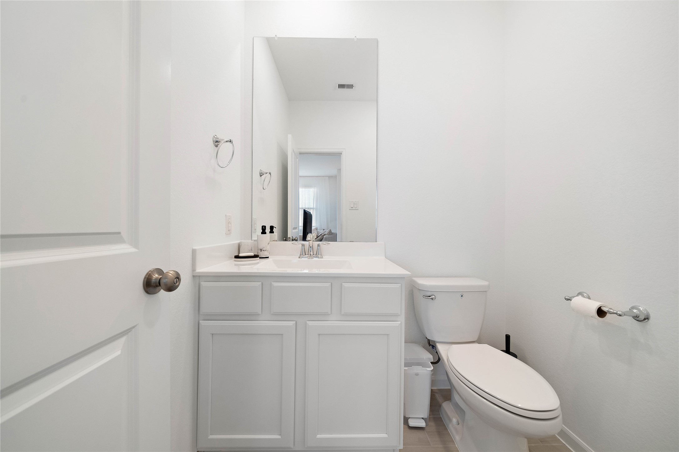 2239 Ginger Trail Lane Rosenberg, TX 77469 - Photo 30 of 35 a bathroom with a toilet a sink and mirror