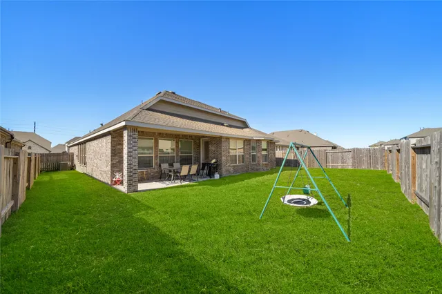 a view of a small house with a park