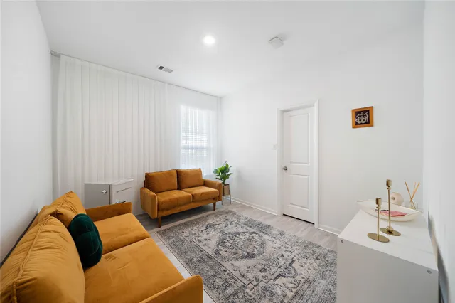 a living room with furniture and a couch