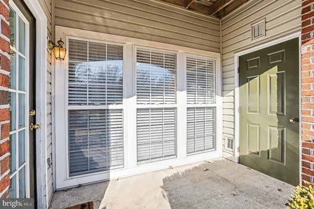 a front view of a house with a large window