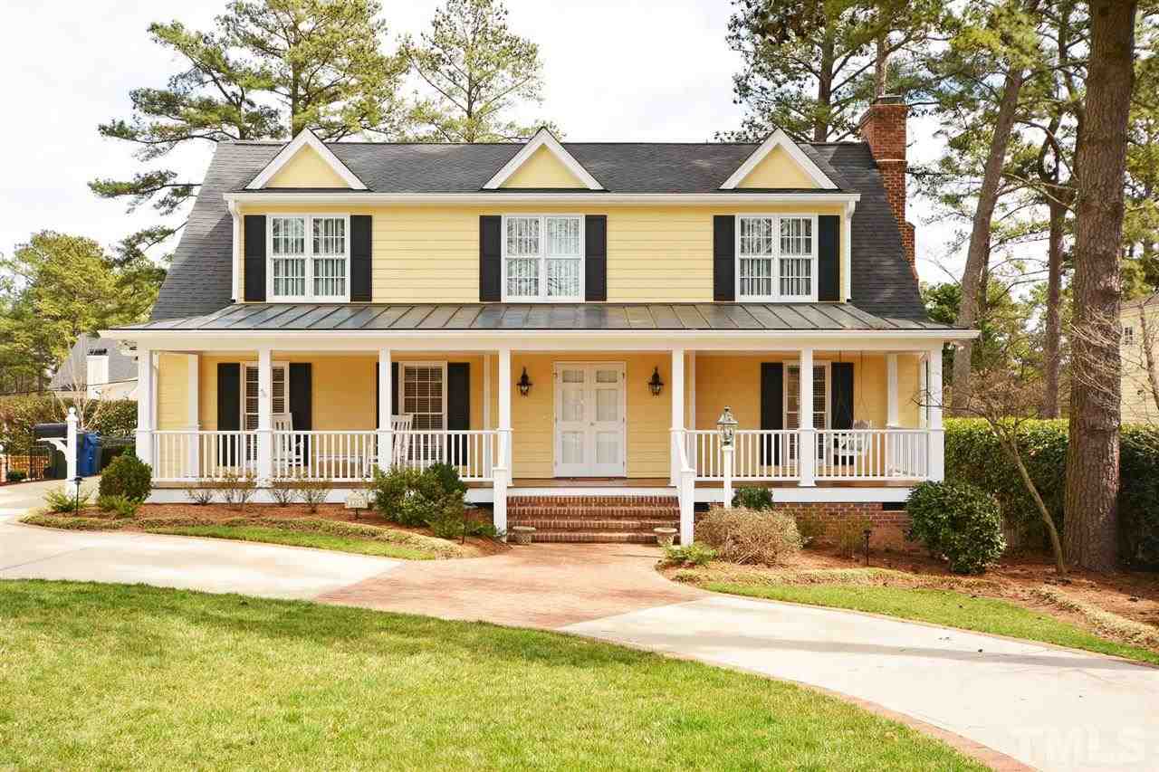 1314 Canterbury Road Raleigh, NC 27608 - Photo 1 of 23 a front view of a house with yard and green space