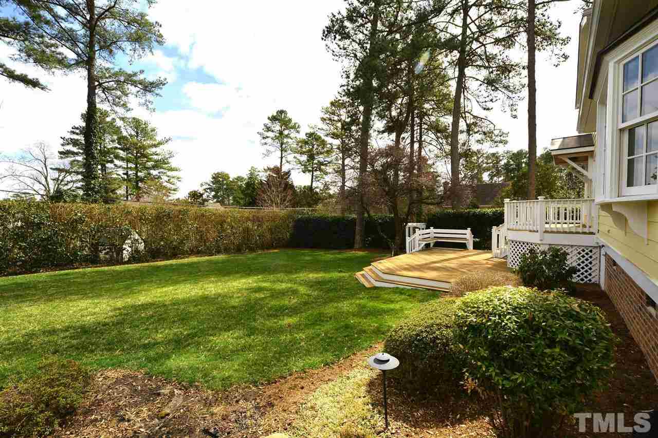 1314 Canterbury Road Raleigh, NC 27608 - Photo 3 of 23 a view of a backyard with sitting area