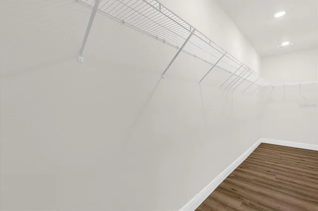 a view of wooden floor with staircase