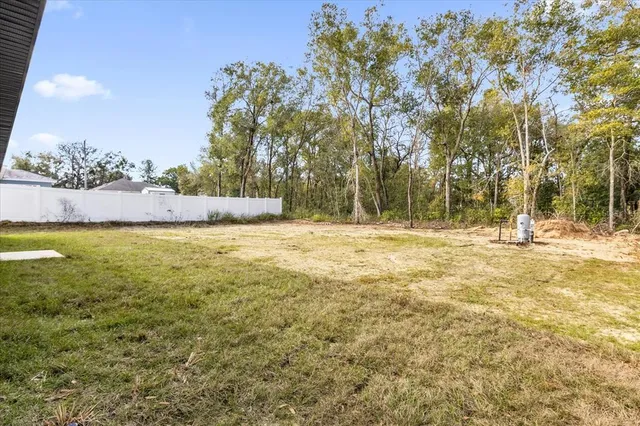 a view of swimming pool with a yard