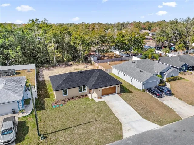 an aerial view of a house with a garden