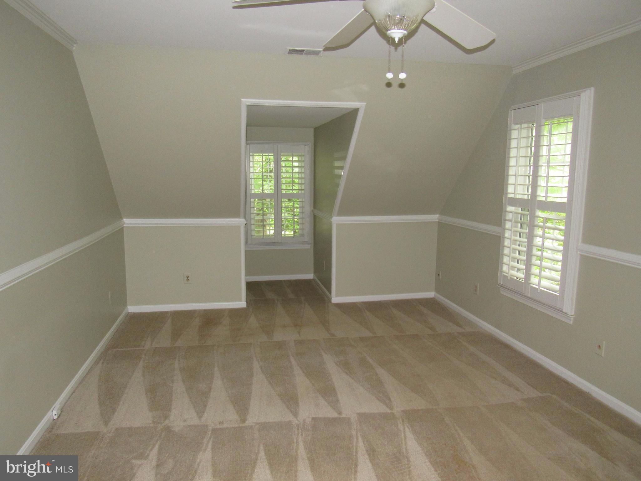 5606 Light Infantry Drive Burke, VA 22015 - Photo 27 of 66 an empty room with windows and entrance