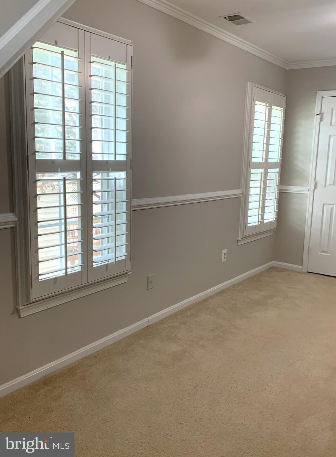 5606 Light Infantry Drive Burke, VA 22015 - Photo 28 of 66 an empty room with windows