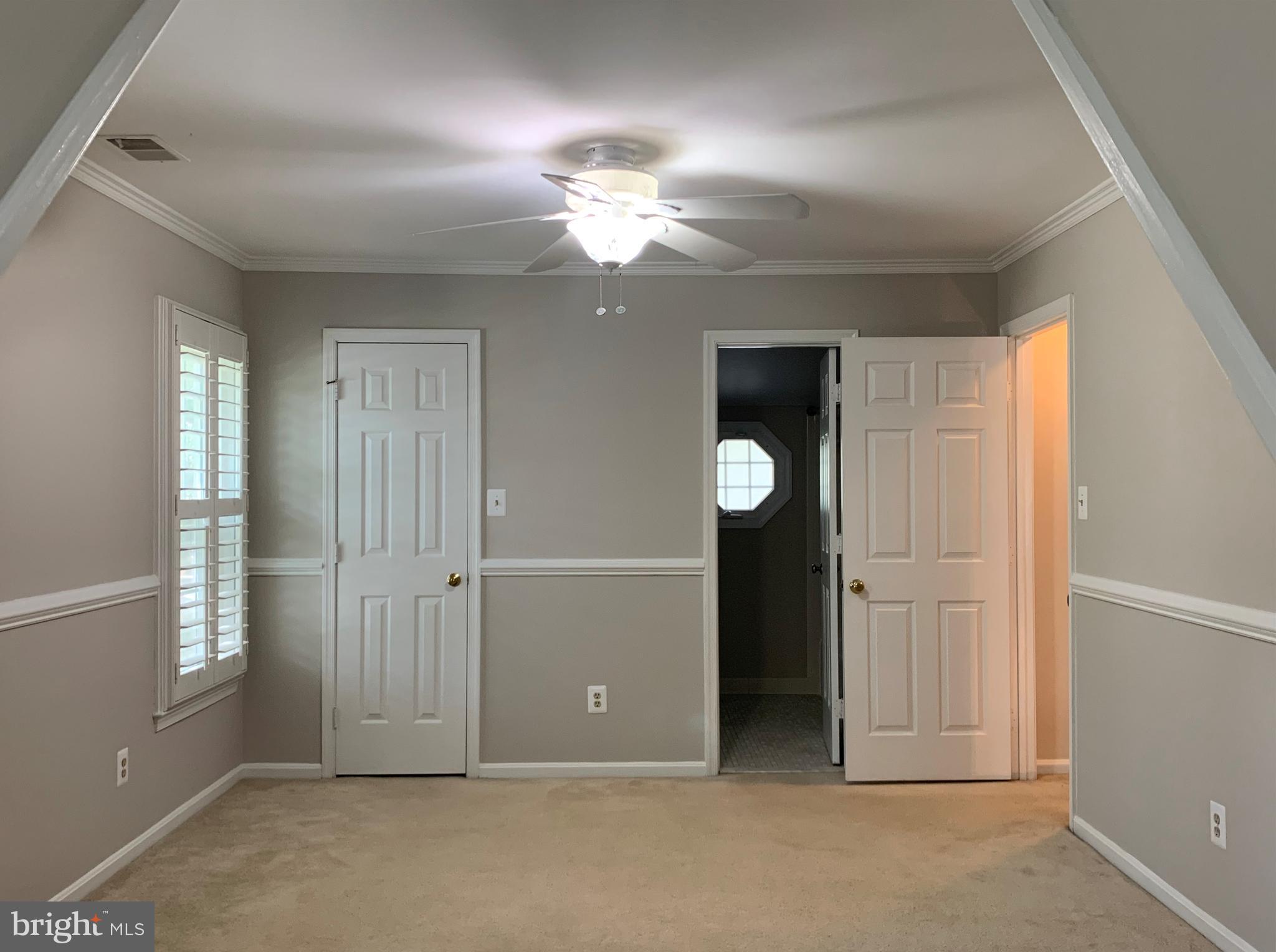 5606 Light Infantry Drive Burke, VA 22015 - Photo 29 of 66 an empty room with closet and a chandelier fan