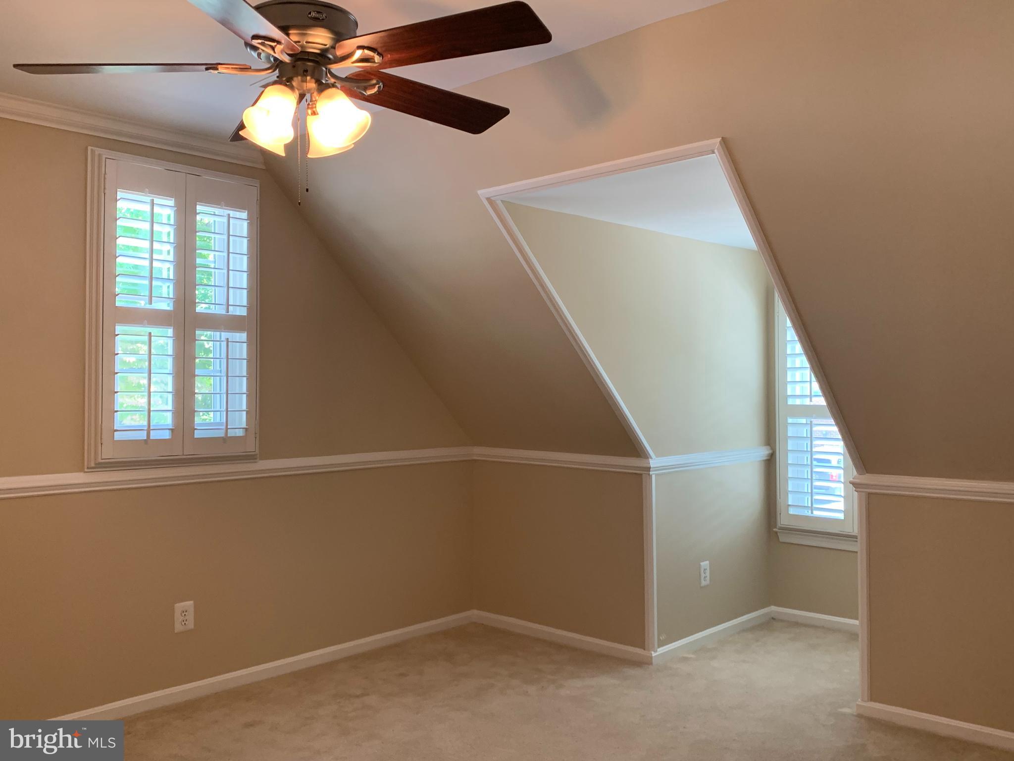 5606 Light Infantry Drive Burke, VA 22015 - Photo 33 of 66 an empty room with windows and fan