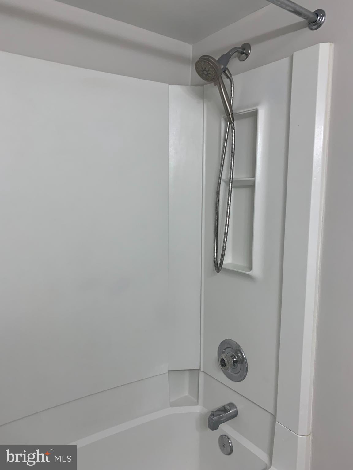 5606 Light Infantry Drive Burke, VA 22015 - Photo 44 of 66 a bathroom with a shower and a sink