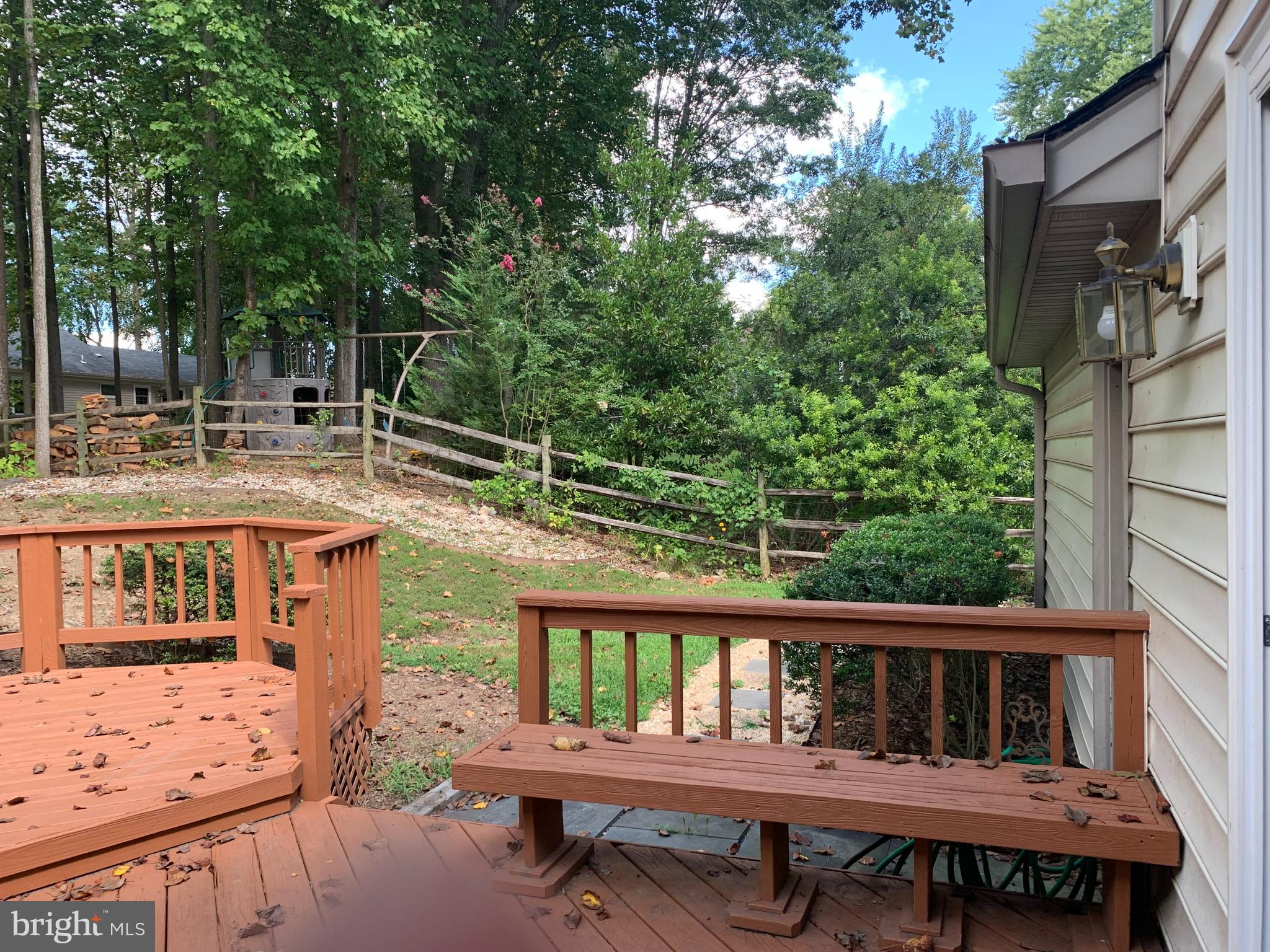 5606 Light Infantry Drive Burke, VA 22015 - Photo 57 of 66 a view of a wooden chairs and table in the balcony