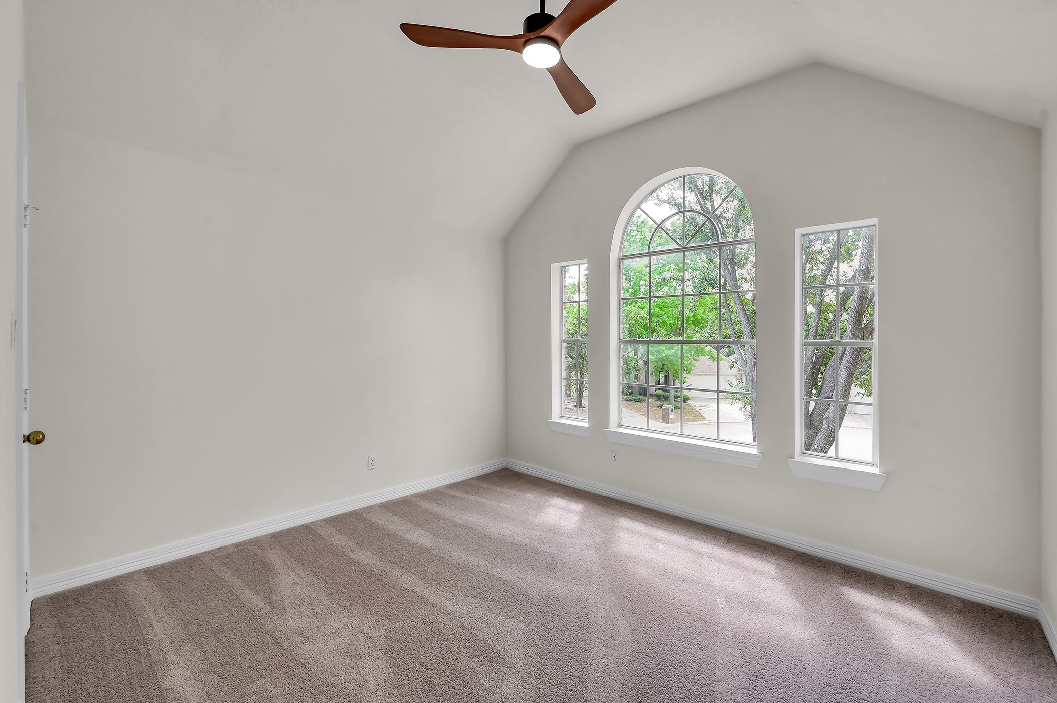 18310 Rittenhouse Park Court Spring, TX 77379 - Photo 25 of 35 Additional secondary bedroom upstairs with a wall of beautiful windows and brand new carpet and ceiling fan.