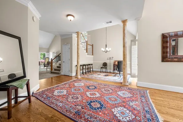 a living room with furniture and a rug