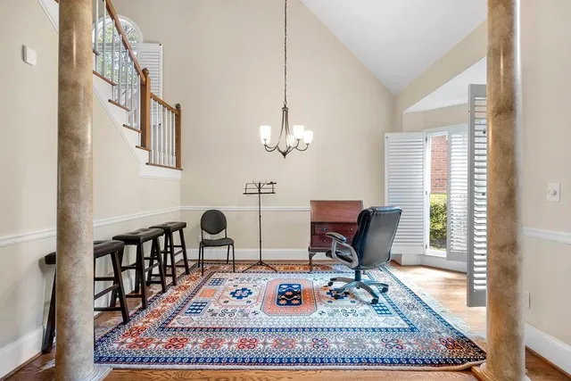 a living room with furniture rug and window