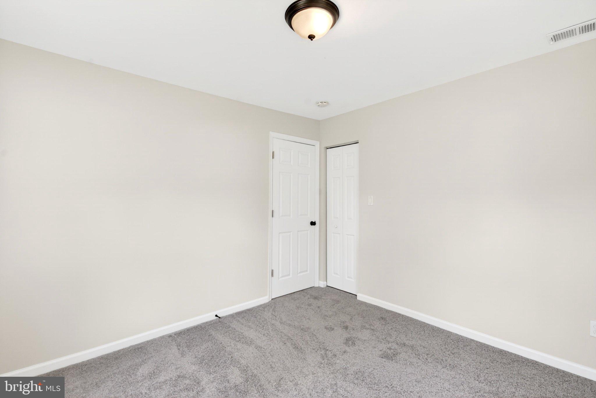 9081 Dumhart Road Laurel, MD 20723 - Photo 23 of 45 Spacious room with neutral tones.