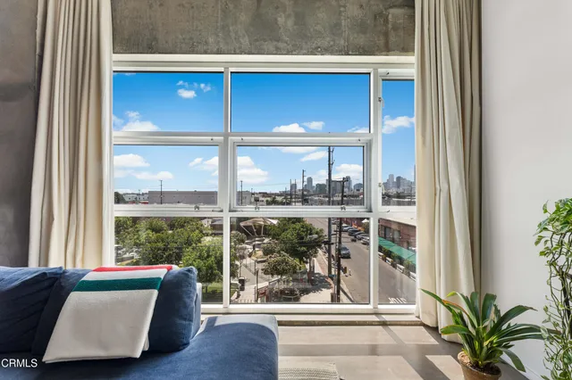 a view of a porch with a floor to ceiling windows with wooden floor