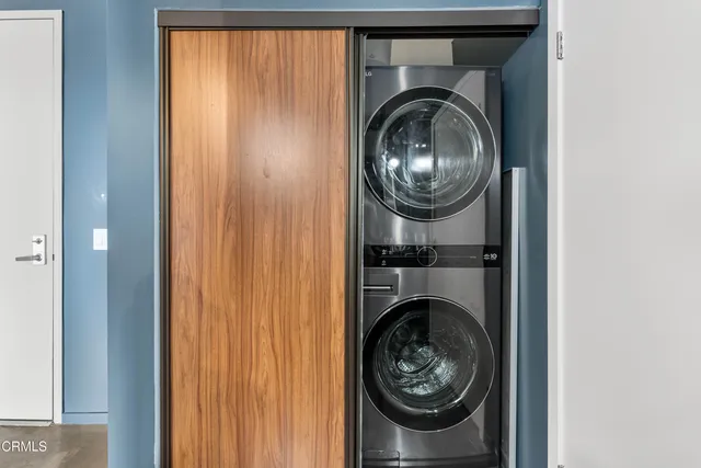 a view of a hallway with washer and dryer