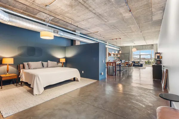 a bedroom with furniture and a table