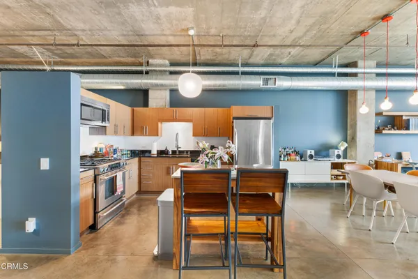a kitchen with a table and chairs in it