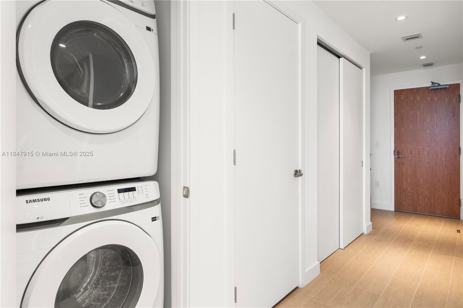 500 Alton Road, Unit 2008 Miami Beach, FL 33139 - Photo 13 of 48 a view of a hallway with washer and dryer