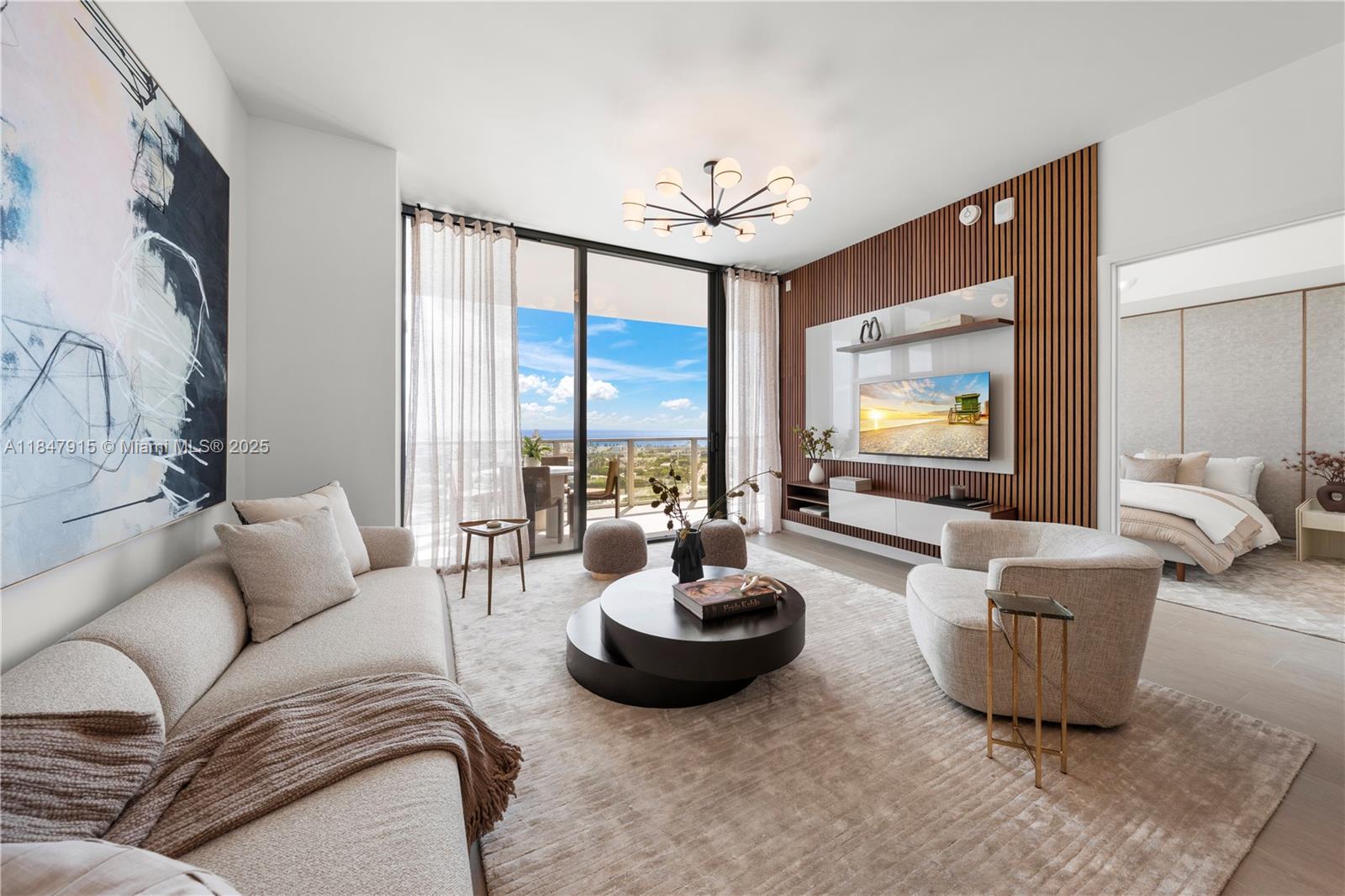 500 Alton Road, Unit 2008 Miami Beach, FL 33139 - Photo 39 of 48 a living room with furniture a flat screen tv and a large window