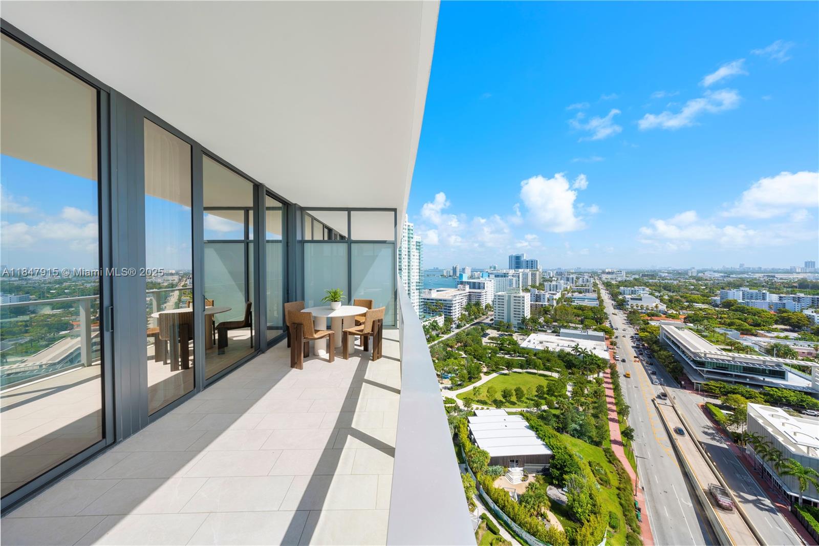 500 Alton Road, Unit 2008 Miami Beach, FL 33139 - Photo 40 of 48 a view of a balcony with couches and wooden floor