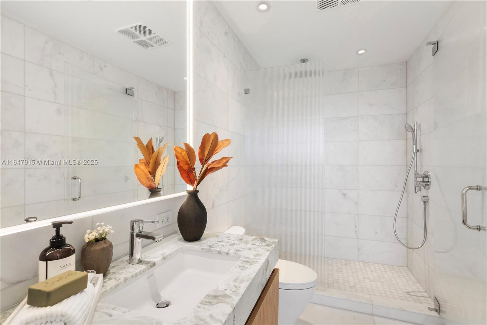 500 Alton Road, Unit 2008 Miami Beach, FL 33139 - Photo 48 of 48 a bathroom with a sink and shower