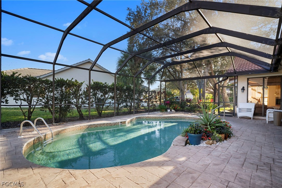 11772 Mahogany Run Fort Myers, FL 33913 - Photo 42 of 50 a view of a swimming pool with a patio