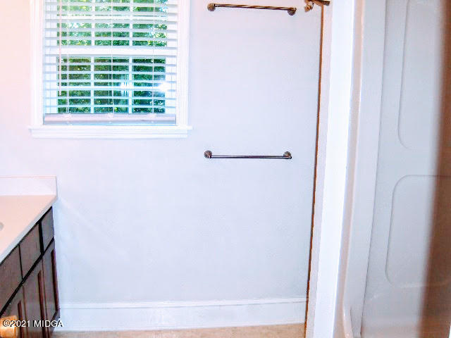 6710 Columbus Road Lizella, GA 31052 - Photo 22 of 32 a bathroom with a bathtub and a window