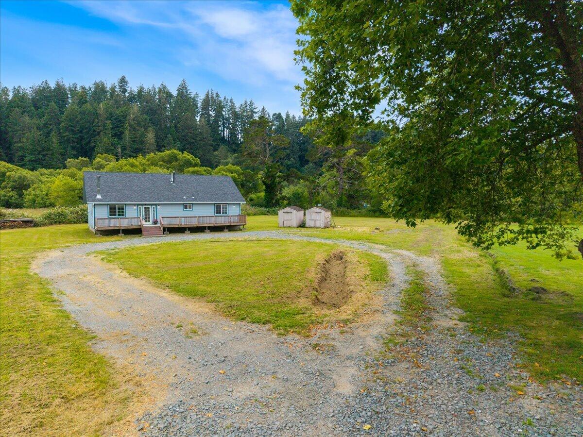 1196 Freshwater Road Eureka, CA 95503 - Photo 6 of 34 a view of a swimming pool with lawn chairs and plants