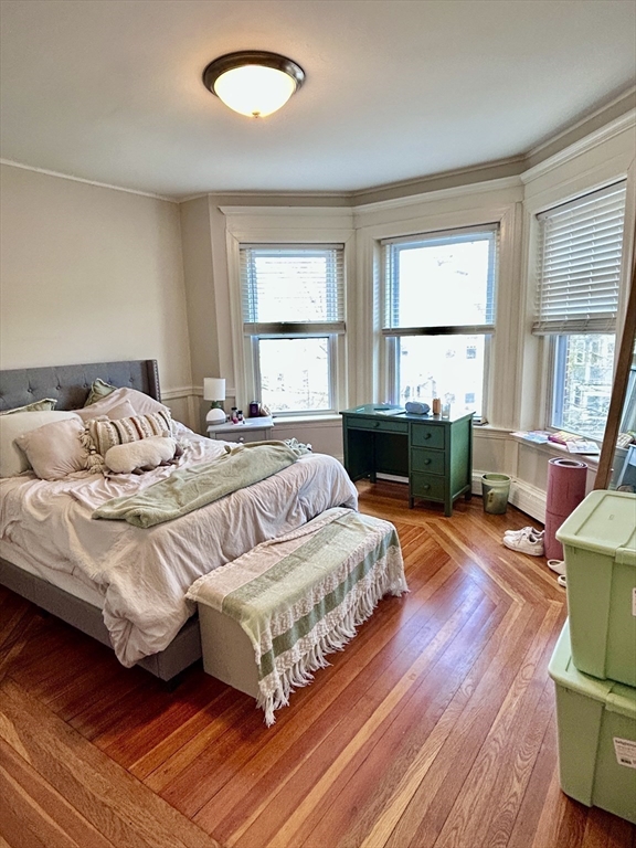 805 Washington Street, Unit 2 Brookline, MA 02446 - Photo 12 of 20 a bedroom with a bed and a window