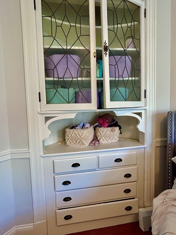 805 Washington Street, Unit 2 Brookline, MA 02446 - Photo 13 of 20 a view of walk in closet with clothes and shoes