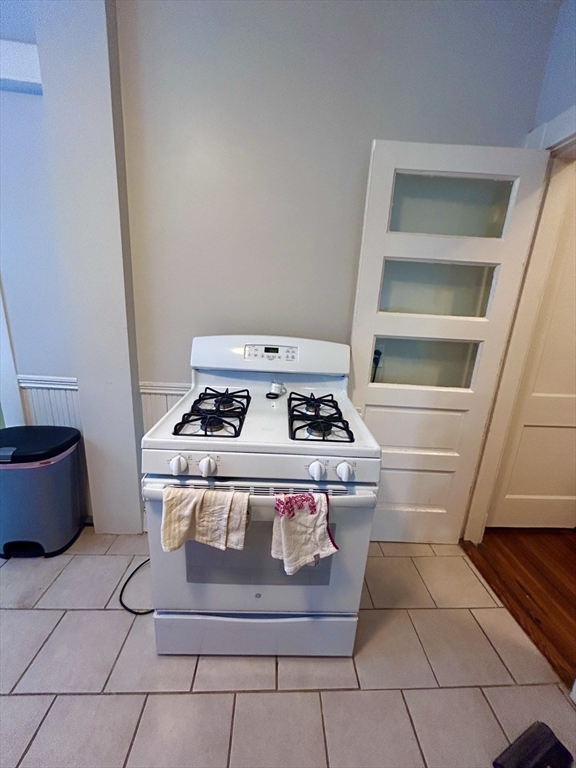 805 Washington Street, Unit 2 Brookline, MA 02446 - Photo 16 of 20 a stove top oven sitting inside of a kitchen