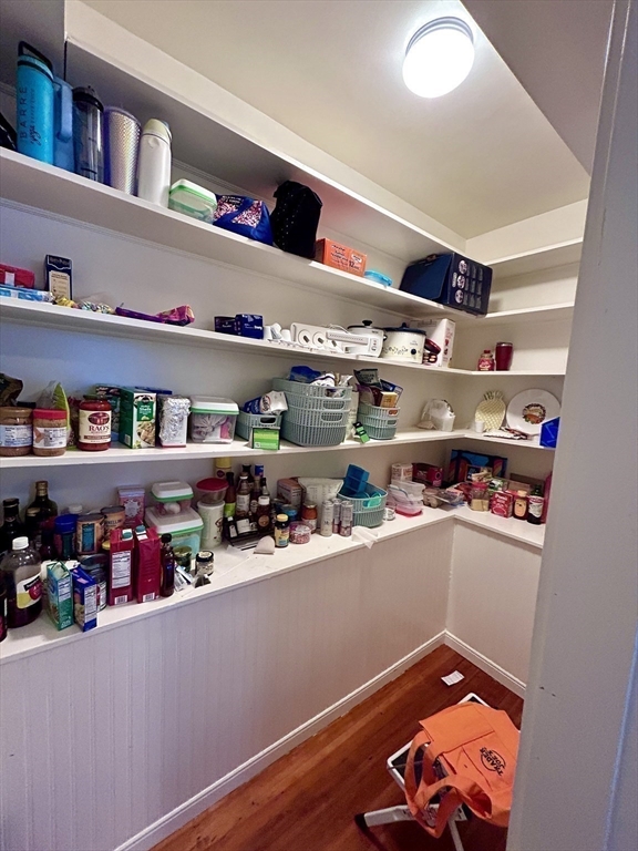 805 Washington Street, Unit 2 Brookline, MA 02446 - Photo 17 of 20 a room with lots of clutter and white cabinets