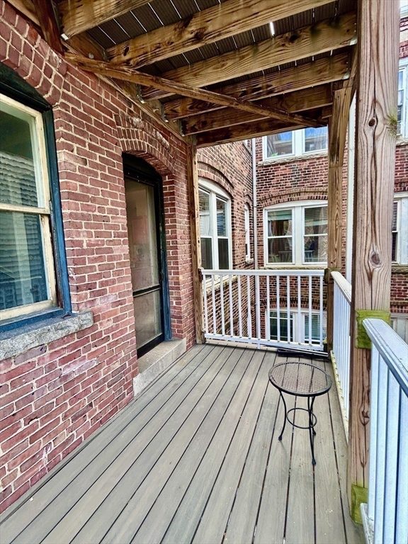 805 Washington Street, Unit 2 Brookline, MA 02446 - Photo 3 of 20 a view of a wooden deck