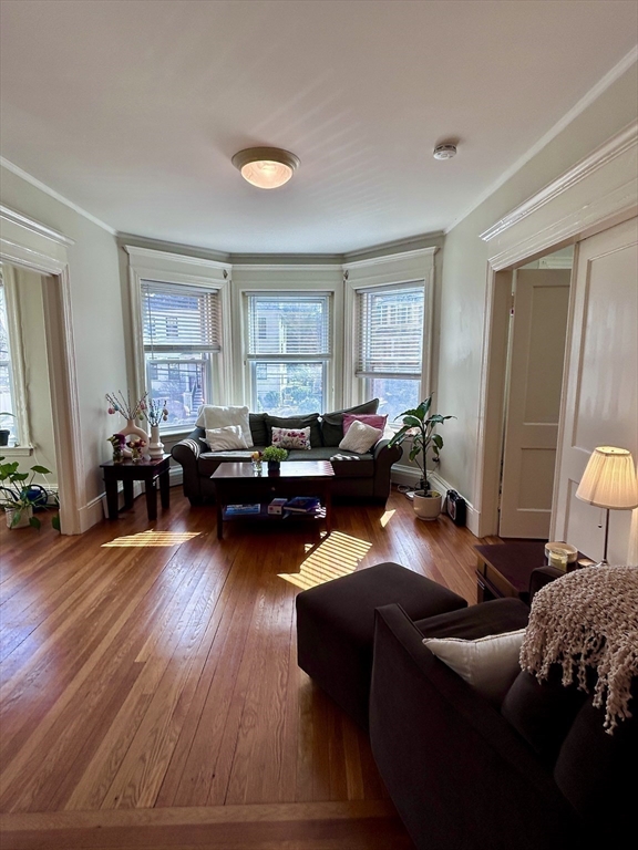 805 Washington Street, Unit 2 Brookline, MA 02446 - Photo 6 of 20 a living room with furniture and wooden floor